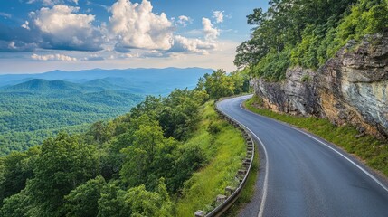 Obraz premium Winding mountain road leading to a scenic overlook
