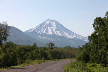 Fototapeta premium Russia Kamchatka volcano Vilyuchinsky on a cloudy summer day
