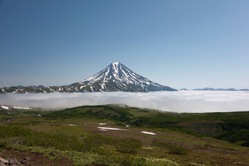 Russia Kamchatka volcano Vilyuchinsky on a cloudy summer day