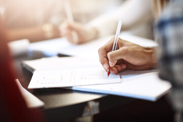 Education, hands and people and notebook in library for scholarship, knowledge or learning. Research, university and exam with students studying at college for project, academy or school resource