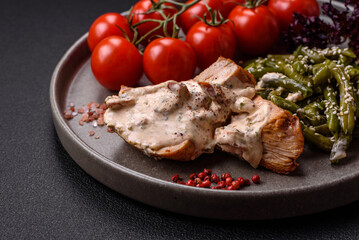 Asian food baked chicken breast with green beans, sesame seeds and sauce