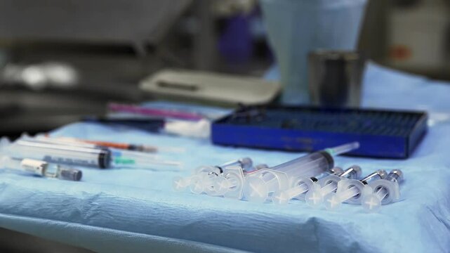 Various medical instruments on a sterile table in the operating room.