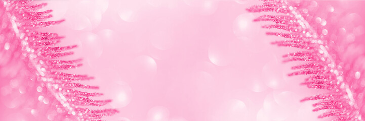 Decorative branch closeup on shiny bokeh background. Selective focus. Abstract holiday backdrop. Celebration and party concept. Copy space