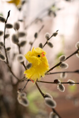 branch with yellow easter chicken