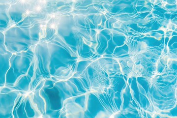 Sparkling sunlight dances across vibrant turquoise water of a pool, creating mesmerizing patterns of light and shadow.