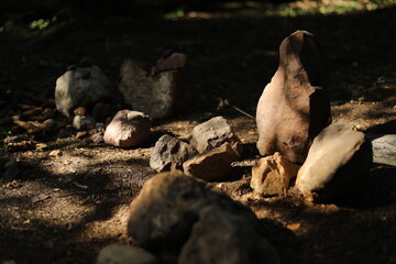 Stones in the forest. A collection of beautiful stones. Antiquities in the mountains.