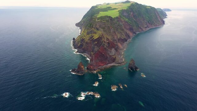Aerial view of the rugged and beautiful island of Sao Jorge with dramatic cliffs and rock formations, Azores, Portugal.