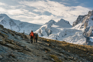 Fototapeta premium Group of backpacker hiking on alpine summit at Switzerland