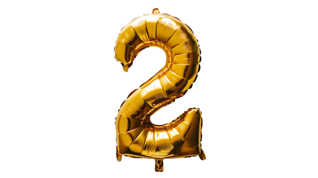 A shiny gold foil number two balloon floats insolated on withe background