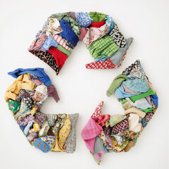 recycling symbol made from colorful patchwork fabrics, promoting sustainability and eco-friendly fashion. Highlighting reuse, up cycling, and circular fashion, PNG