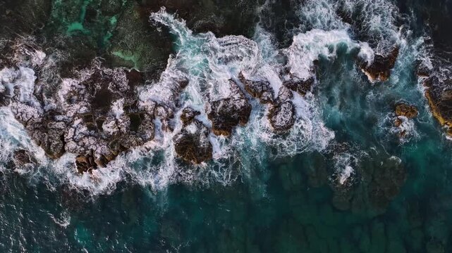 Aerial view of beautiful tropical island reef with crashing waves in the ocean, Tongatapu, Tonga.
