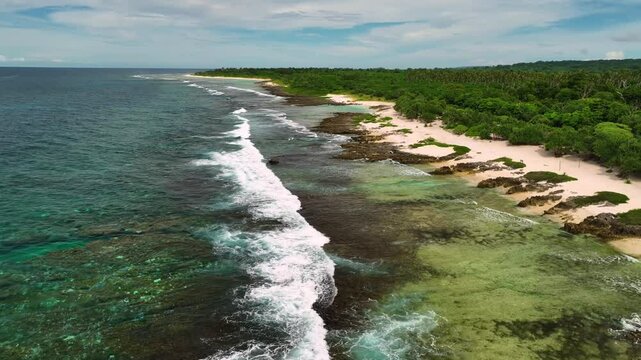 Aerial view of a beautiful tropical island with pristine beaches and crashing waves, Shefa Province, Vanuatu.