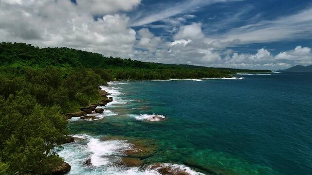 Aerial view of a tropical paradise island with pristine beaches, azure ocean, and lush palms, Shefa Province, Vanuatu.