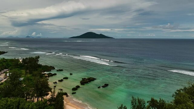 Aerial view of a beautiful tropical island with lush greenery and crystal clear waters, Shefa Province, Vanuatu.