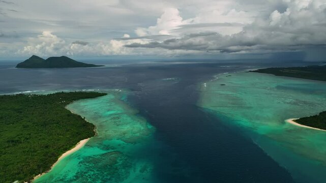 Aerial view of a beautiful tropical island with turquoise lagoon and reef, Shefa Province, Vanuatu.