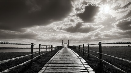 Naklejka premium Generative AI, Wooden bridge leading into the horizon under dramatic skies in black and white