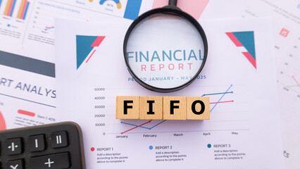 Wooden cube with the word FIFO. It is an abbreviation of First In, First Out. Business profitability success growth profitability analytics. Business and financial concept.