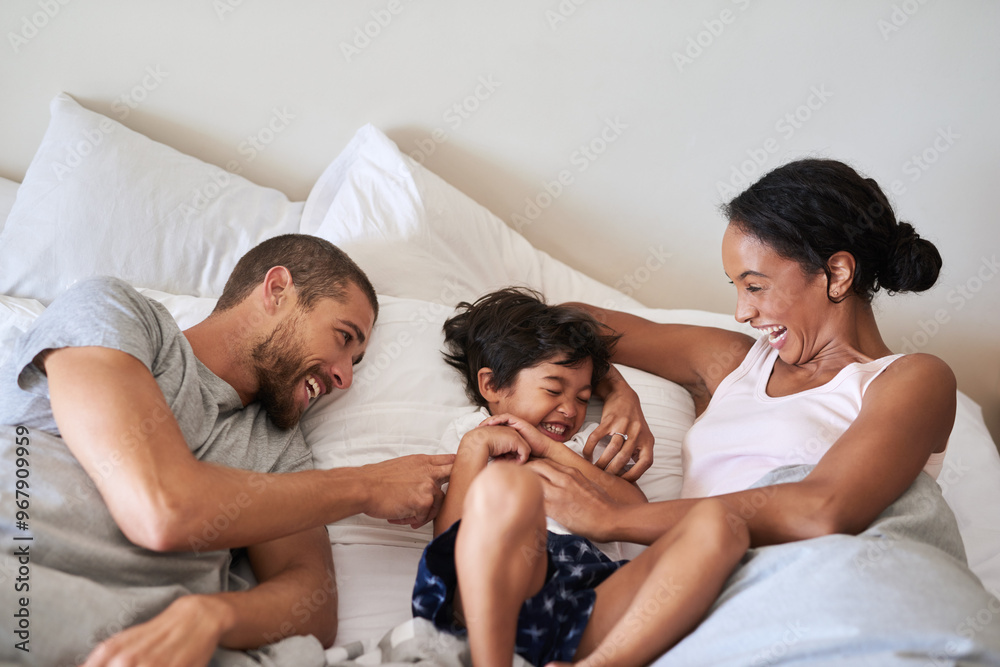 Canvas Prints Laugh, playing and parents with child in bedroom for bonding, love and playful relationship. Family, childhood and mother, father and kid tickle for happiness, fun and relax on bed together in home