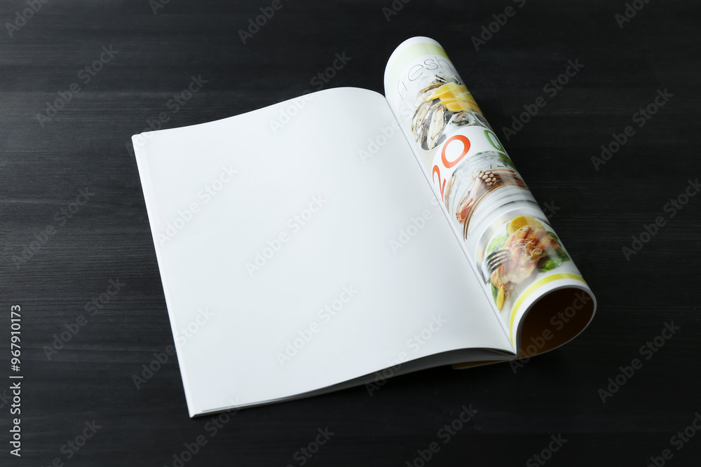 Poster Open magazine on black wooden table. Mockup for design