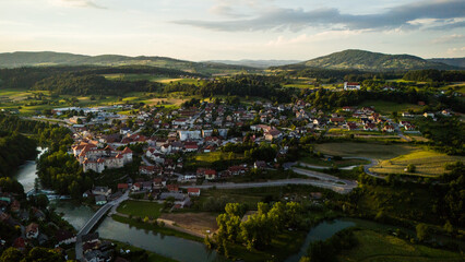 Zuzemberk Castle and medieval village on the river Krka in Slovenia. Aerial drone view