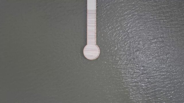 Aerial view of serene and tranquil lake with a dock, Lipno nad Vltavou, Czech Republic.