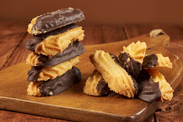Homemade vanilla cookies, half covered in delicious bitter chocolate