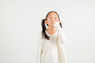 Portrait Asian young kid girl emotions tired and sleepy yawning covering mouth open by hand, studio shot isolated on white background, Thai kindergarten child insomnia concept with copy space