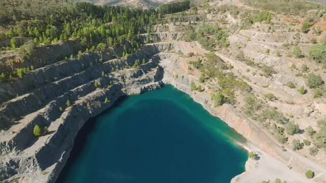 Aerial view of serene Highbury Quarry with beautiful blue water and lush greenery, Adelaide, Australia.