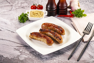 Delicous natural roasted sausages in the plate