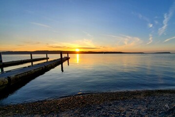 Fototapeta premium sunset on the pier, dock, bay, ocean, colorful.