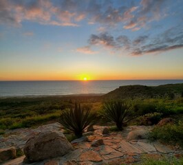sunset over the sea, panoramic view, clouds, room for copy
