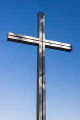 A cross against the blue sky.