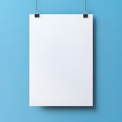 Blank paper hanging on a blue wall.