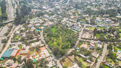 park in the middle of the suburbs surrounded by residential houses