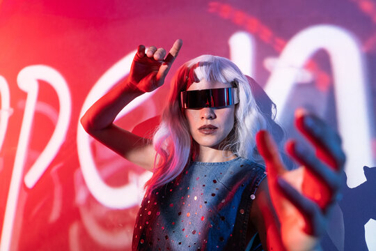 Futuristic woman engages with digital interface in metaverse