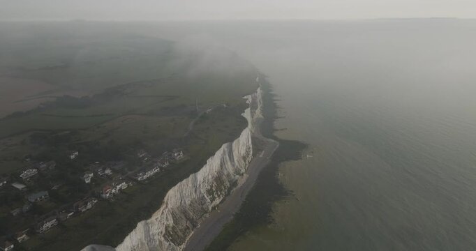 Aerial view of the majestic white cliffs overlooking the serene English Channel, Dover, United Kingdom.