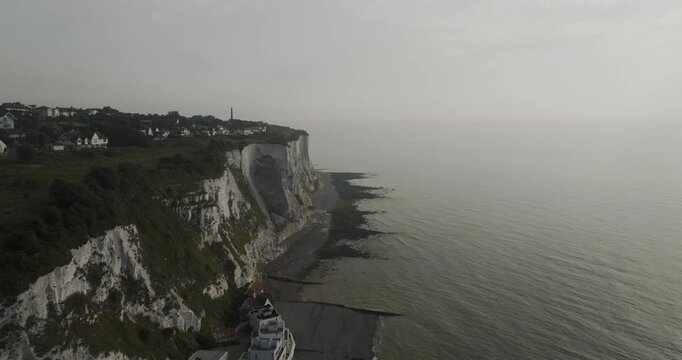 Aerial view of the majestic white cliffs of Dover by the serene English Channel, Dover, United Kingdom.