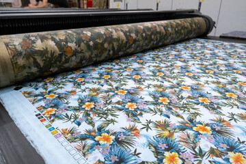 Fabric printing machine in a textile factory in close up view.