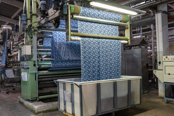Fabric machine industrial plant line in a textile factory.