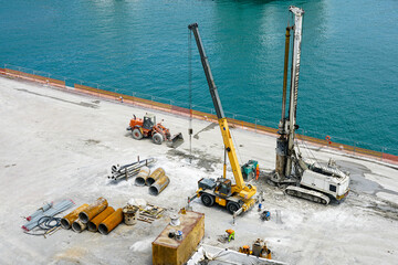 Installation of pile casings in the port quay, drilling rig, port infrastructure upgrade works