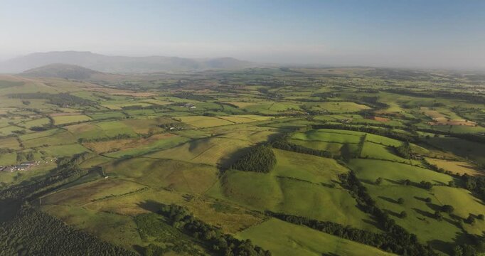 Aerial view of beautiful countryside with rolling hills and lush fields, Kyle, Scotland.