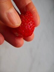 strawberry in hand