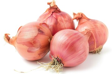 A group of onions sit on a white surface