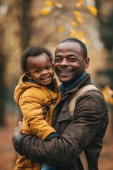 Fototapeta premium A parent holding a young child close, possibly during a family moment or in times of crisis