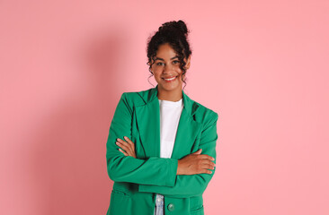 Beautiful woman in stylish jacket on pink background