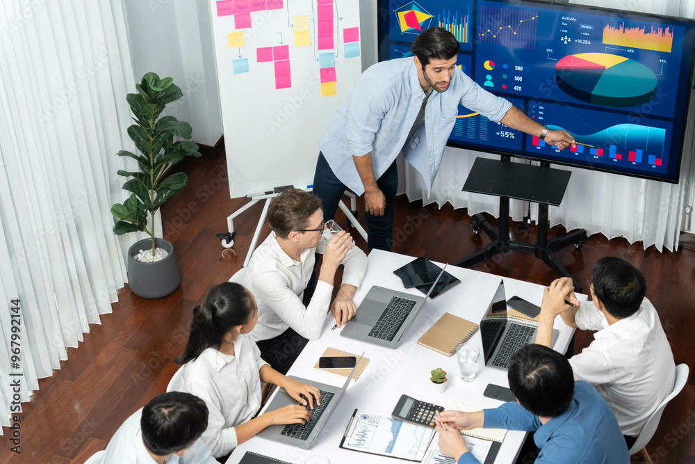 Leinwandbilder Presentation in office or meeting room with analyst team utilizing BI Fintech to analyze financial data. Businesspeople analyzing BI dashboard power display on TV screen for strategic planning.Prudent