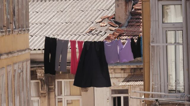 Clothes are drying in stanbul, turkey street, Colorful Laundry Pieces Gracefully Hanging Amidst Contemporary Urban Architecture Scenes