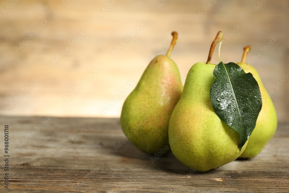 Canvas Prints fresh green pears and leaf on wooden table, closeup. space for text