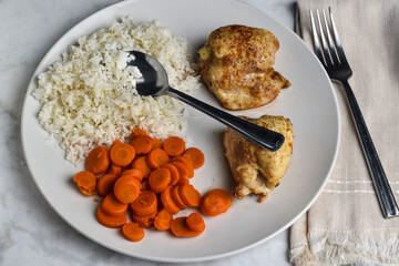 seasoned chicken thighs  carrots and rice