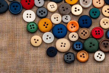 Obraz premium Close-Up of Various Buttons, Textile Fasteners and Fashion Accessories